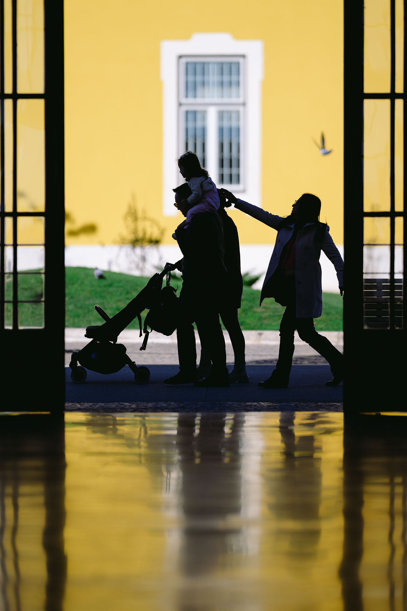 Family silhouettes at the Terreiro do Paco station in Lisbon, Portugal