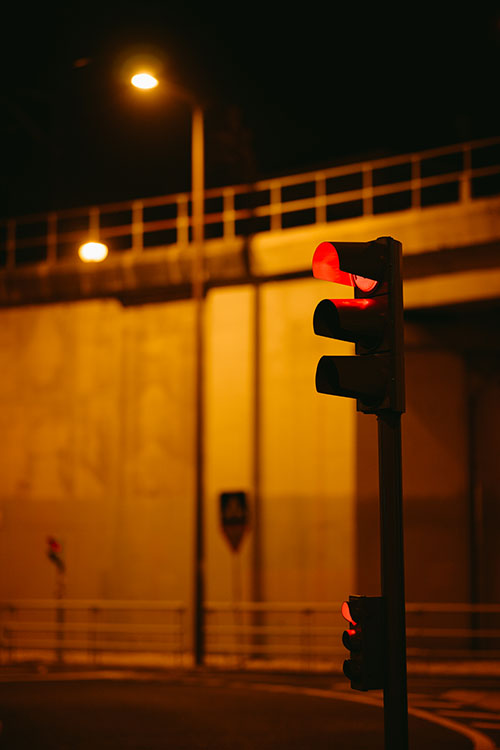 Red traffic lights just before midnight in Paco de Arcos, Portugal